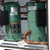 Wisperkool 20 Ton HVAC, industrial cooling system with two green compressor units connected by copper piping.