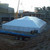 7' x 30' White Royalty Sidewall, large white tent on construction site with building structures in the background.