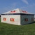 8' x 20' Royalty SW Full Print Tent, outdoor event tent with custom printed logos and slogan shown on a grassy field.
