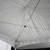 20' x 20' Pinnacle Tent Liner, close-up view of the white fabric lining with support cables and ruffled edge for tent interior decoration.