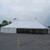 Celina Tent 30' x 60' Classic Series Pole Tent, Sectional Tent Top, Complete, large white event tent set up in an open area with American flags in the background.