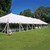 Celina Tent 40' x 120' Classic Series Pole Tent, Sectional Tent Top, Complete, outdoor white event tent set up on green grass with trees in the background and a clear blue sky.