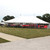 Celina Tent 40' x 60' Classic Series Pole Tent, Sectional Tent Top, Complete, large white event tent set up outdoors on grass with supporting poles and a clear sky.