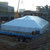 Celina Tent 60' x 140' Classic Series Pole Tent, Sectional Tent Top, Complete, white construction tent with a peaked roof at a construction site.