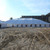 Celina Tent 80' x 120' Classic Series Pole Tent, Sectional Tent Top, Complete, large white sectional pole tent set up outdoors on dirt ground with clear sky background.