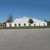 Celina Tent 80' x 120' Classic Series Pole Tent, Sectional Tent Top, Complete, outdoor event tent in white with clear windows on a grassy field under a clear blue sky.