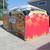 Celina Tent 10' x 20' Master Series Frame Tent, 1 Piece Tent Top, Complete, colorful outdoor event tent with racing-themed graphics and promotional banners.