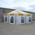 Celina Tent 20\' x 20\' Master Series Frame Tent, 1 Piece Tent Top, complete, with white and yellow striped canopy and sidewalls with windows, set up outdoors on a gravel surface.