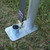 Celina Tent 20' x 40' Master Series Frame Tent, 1 Piece Tent Top, Complete, ground mounting hardware with metal base plate and pole before installation on grass ground.