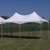 Celina Tent 10' x 20' Pinnacle Series High Peak Frame Tent / Cross Cable Marquee, white high peak frame tent set up outdoors on grass field with supporting red and blue cables.