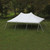 Celina Tent 20' x 30' Premiere I Series High Peak Pole Tent, white event tent with high peak and stakes on a grassy field.