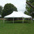 Celina Tent 20' x 30' Premiere I Series High Peak Pole Tent, 1 Piece Tent Top, Complete, outdoor event tent in a grassy area with trees.