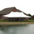Celina Tent 20' x 40' Premiere I Series High Peak Pole Tent, 1 Piece Tent Top, Complete, outdoor event tent set up next to a house by a body of water.