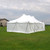 Celina Tent 20' x 40' Premiere I Series High Peak Pole Tent, 1 Piece Tent Top, Complete, set up outdoors on green grass with a partly cloudy sky in the background.