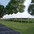 Celina Tent 40' x 120' Premiere I Series High Peak Pole Tent, Sectional Tent Top, complete setup in an outdoor park area with trees and grass.