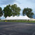 Celina Tent 40' x 120' Premiere I Series High Peak Pole Tent, Sectional Tent Top, Complete, white large outdoor event tent set up on grass with trees in the background.