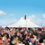 Celina Tent 40' x 60' Premiere I Series High Peak Pole Tent, Sectional Tent Top, Complete, showcasing an outdoor event under a large white sectional pole tent with a crowd of attendees and a clear blue sky.