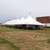 Celina Tent 40' x 180' Premiere II Series High Peak Pole Tent, Sectional Tent Top, Complete, white large event tent with high peak roof and multiple sections, set up on a grassy field for outdoor event.