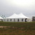 Celina Tent 40' x 60' Premiere II Series High Peak Pole Tent, Sectional Tent Top, Complete, large white event tent set up outdoors on grassy area with open sides and peaked roof, suitable for weddings, parties, and events.
