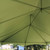 20' x 30' Master Series High Peak Frame Tent, 1 Piece Tent Top, Complete, showing the interior view of the green tent roof structure with metal support beams.
