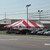 Celina Tent 30' x 30' Classic Series Frame Tent, 1 Piece Tent Top, Complete, outdoor event tent with red and white striped canopy set up on a parking lot.