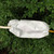 Ratchet Cover, Small, protecting a tool from dirt and moisture, outdoor setting with green foliage in the background.