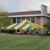 Celina Tent 40' x 40' Classic Series Frame Tent, Sectional Tent Top, Complete, setup outdoors with a house in the background and green lawn in the foreground.