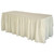 Celina Tent 17' Ivory Polyester Skirting, a long, elegant beige skirt draped over a table for event décor.