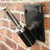 25 Degree Wall Bracket, black metal wall-mounted support for shelving or equipment with sturdy mounting plate.