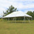 Celina Tent 20' x 30' Classic Series Pole Tent Logo Print, complete outdoor tent setup on grassy field with trees and a blue sky in the background.