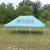 Celina Tent 20' x 30' Classic Series Pole Tent Full Digital Print, Complete, blue outdoor event tent with digital graphics on the fabric, set up on a grassy field with trees in the background.