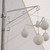 2'' to 3'' Pole Clamp, white metal decorative street light fixture with multiple globe lights attached to a pole for outdoor lighting.