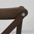 Chocolate Dover Cross Back Chair, close-up image showing the dark brown wooden chair frame and metal bolt connecting the backrest to the leg.