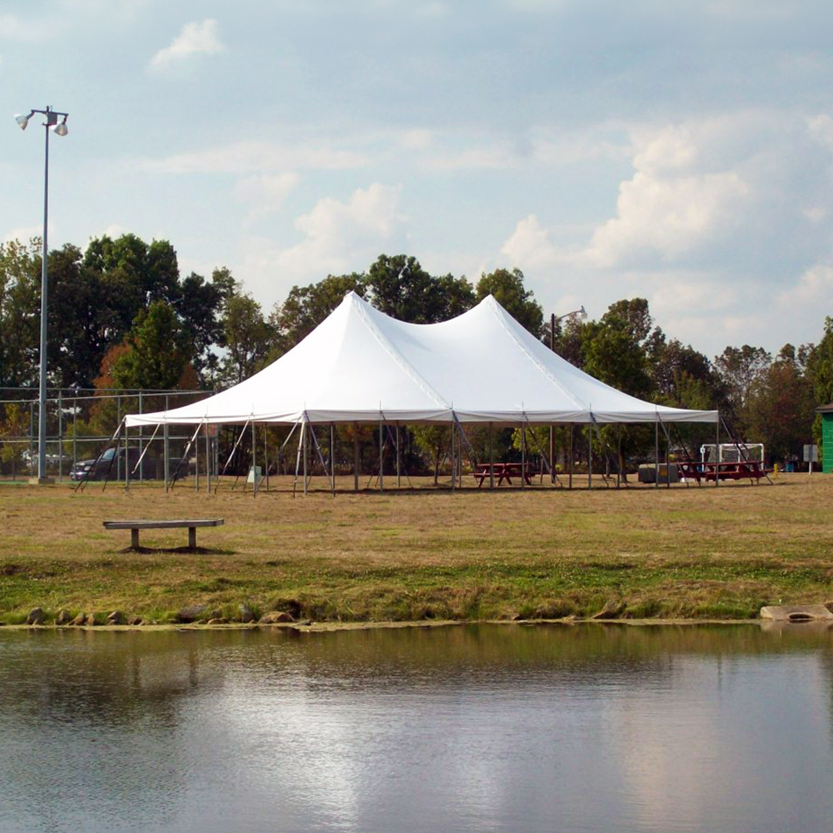 Elegant tent setup for a corporate event with Florida Event Decor styling
