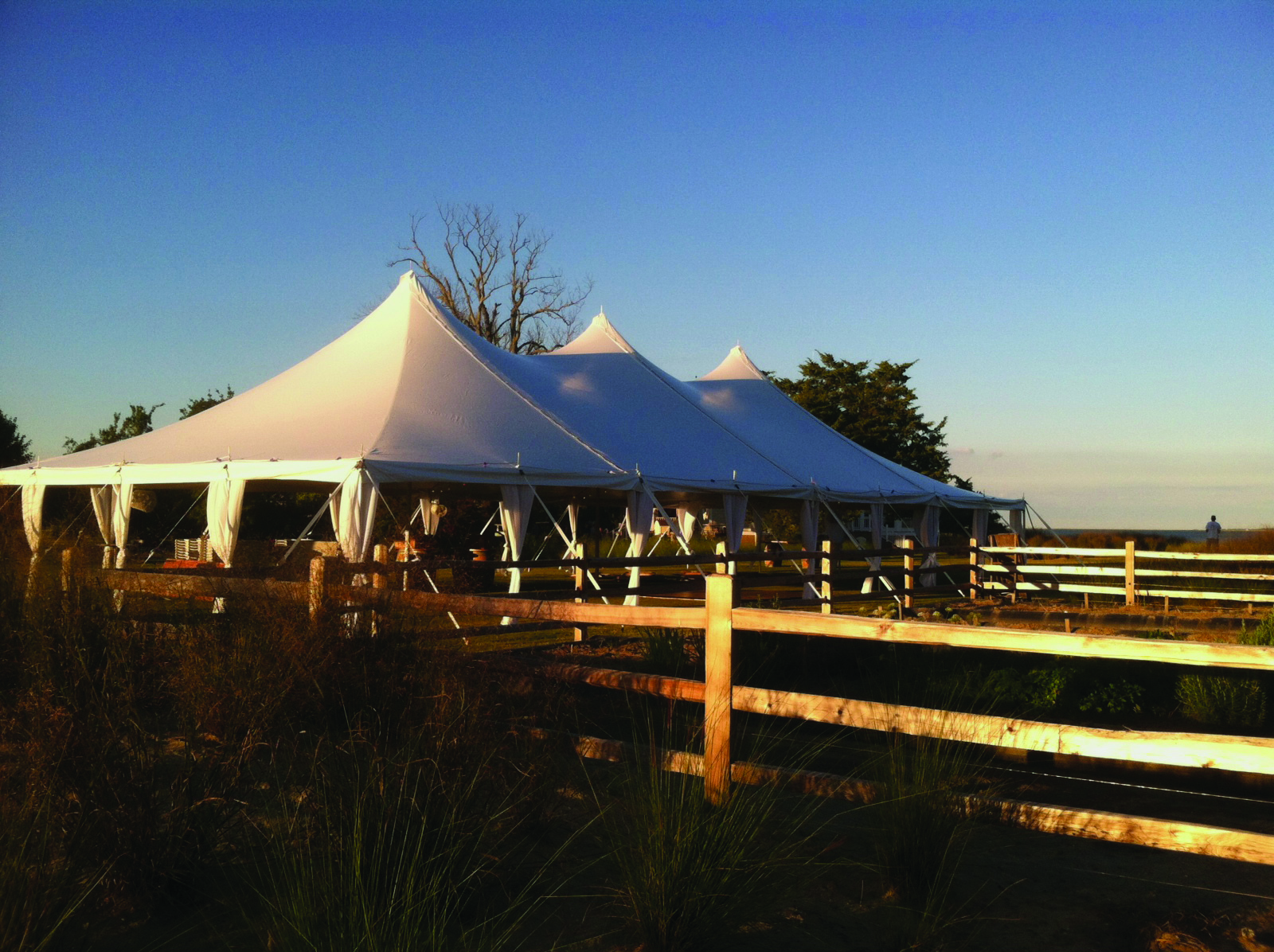 Oktoberfest party tent setup with tables and benches