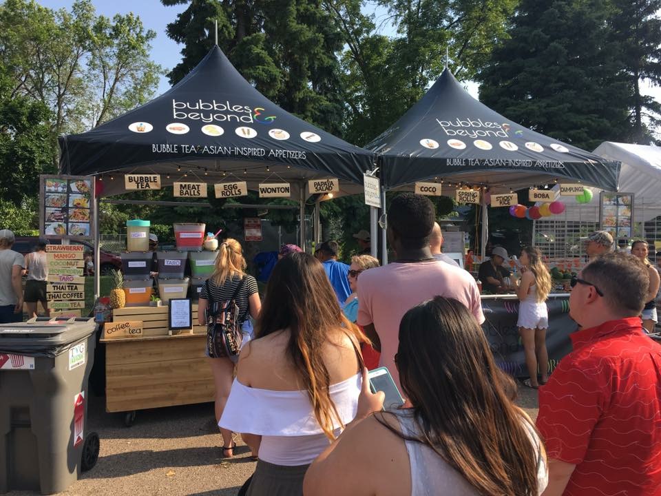 Custom canopy tent with branding at an outdoor event