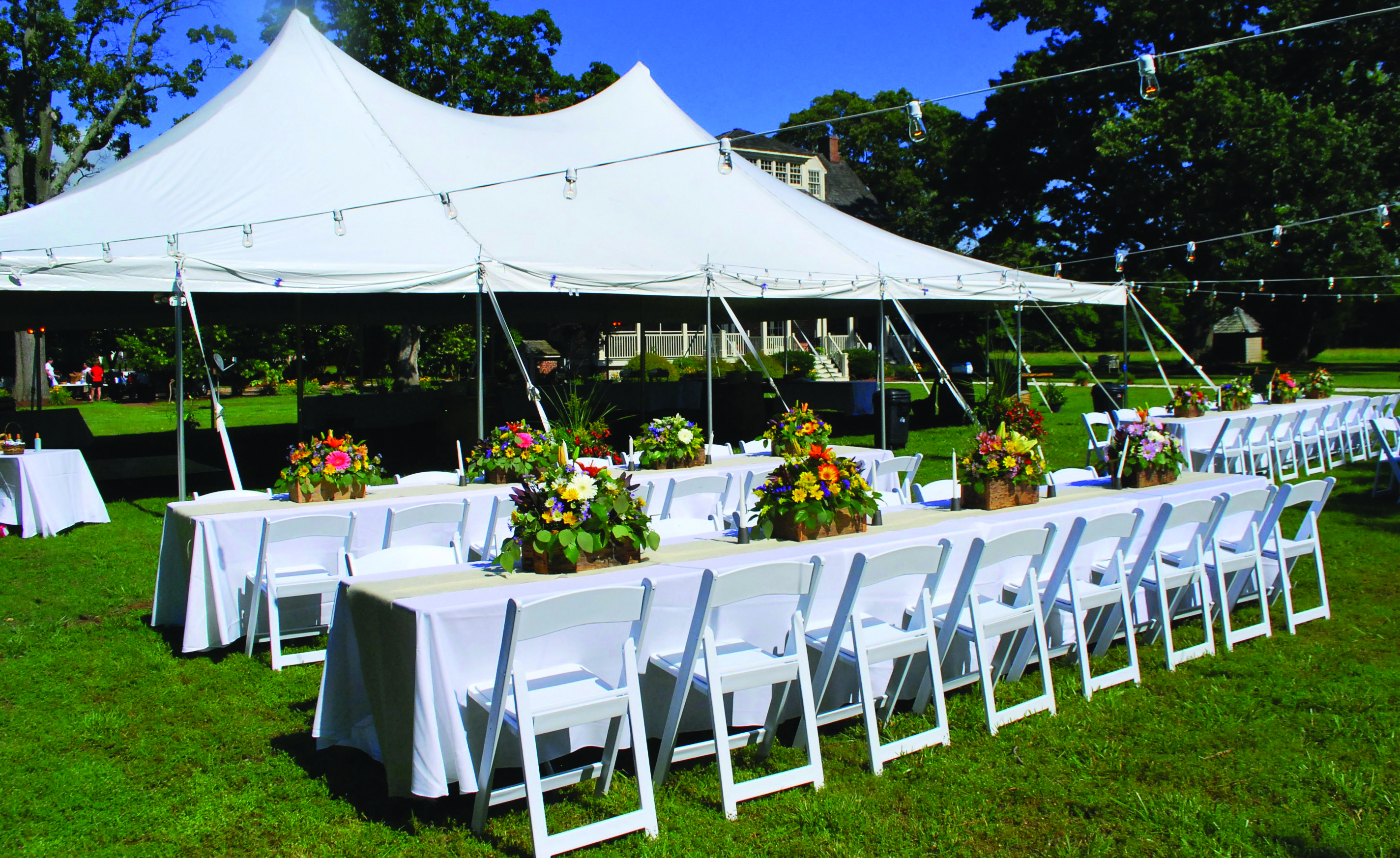 White folding chairs set up for an event