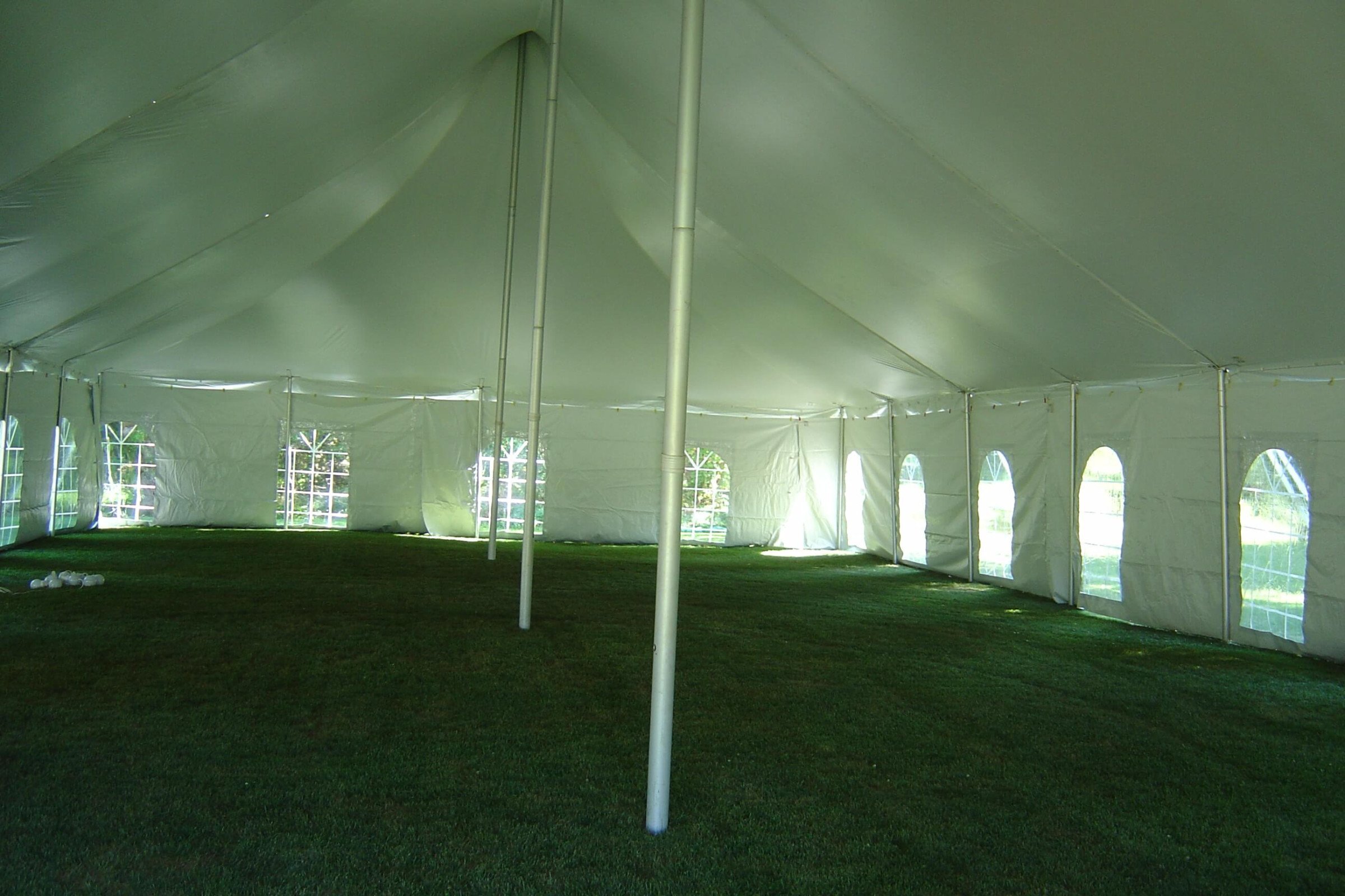 Event tent setup showing poles and hardware