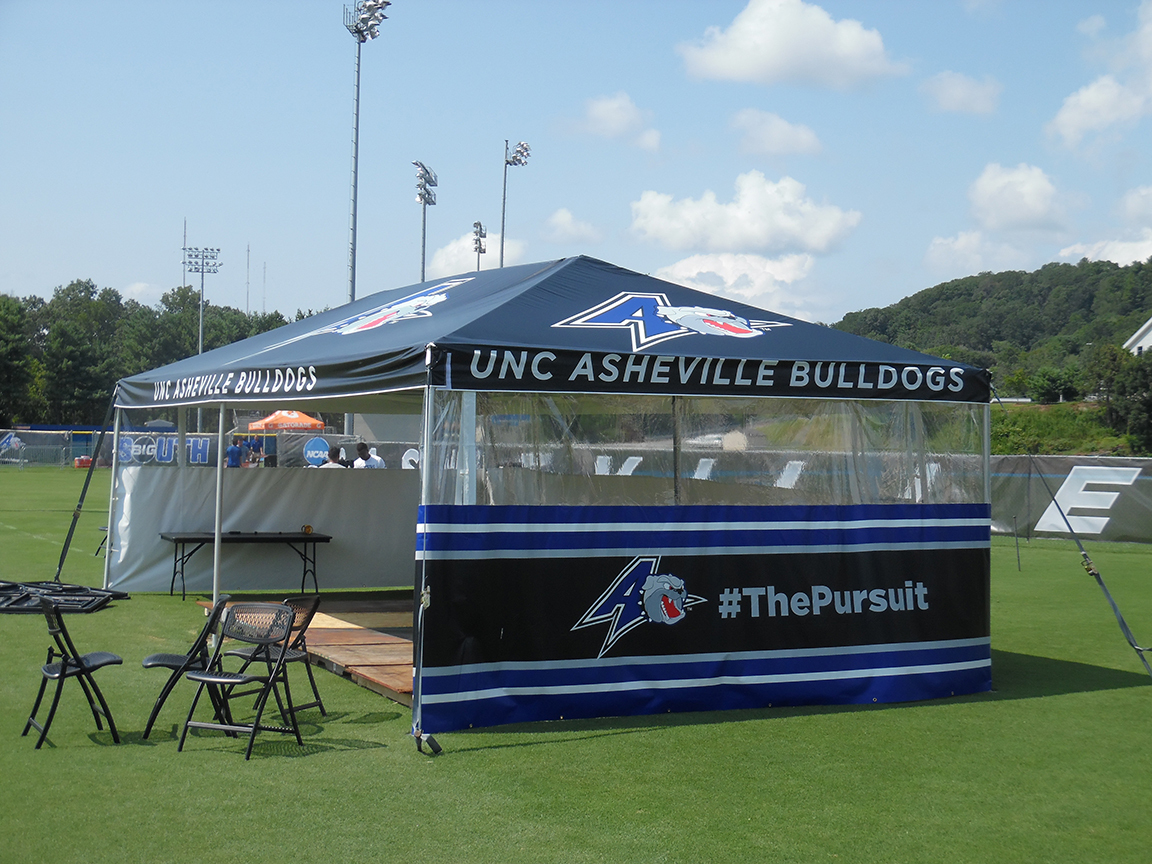 Custom tailgate tent setup at a sports game