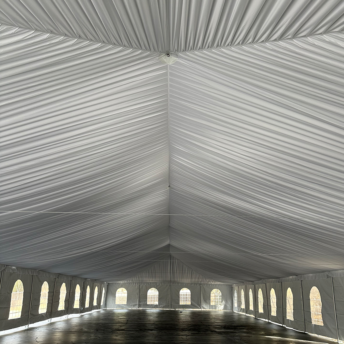 Elegant event tent with white canopy liner