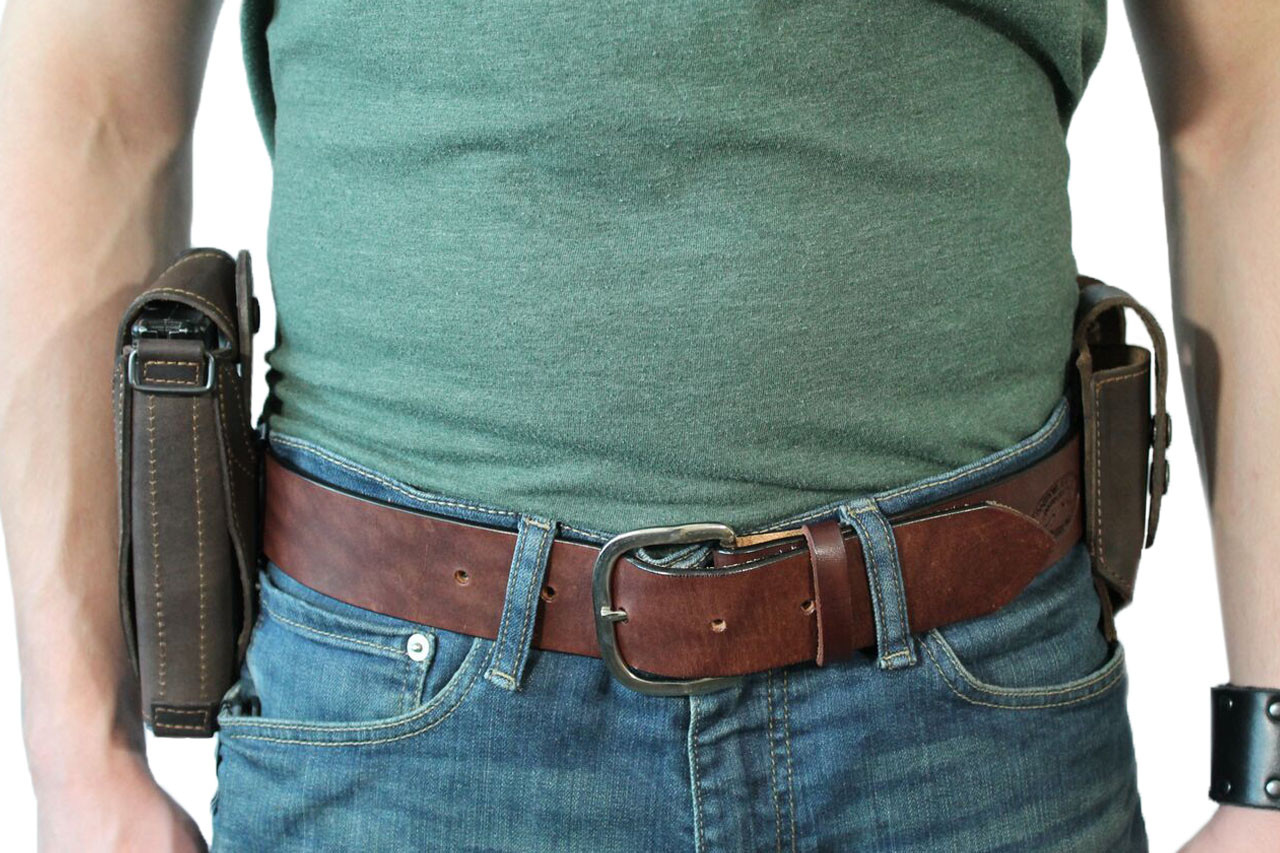 leather ambidextrous holster with magazine pouch on belt