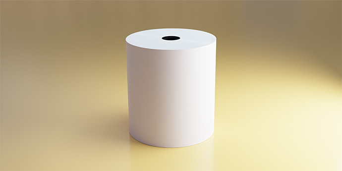 Thermal paper roll sitting on a yellow surface