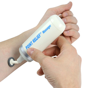 Point-Relief Mini-Massager (with 4 diff. massage heads) on wrist