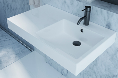 White wall-hung rectangle wash basin with ample counter space