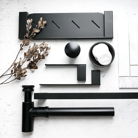 Close-up view of sleek black bathroom accessories