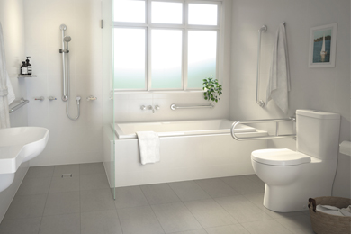 A modern bathroom setup with a white close coupled toilet, sink, rail shower, and towel rail