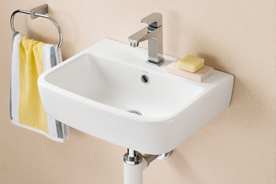 Space-saving floating sink with taps and a convenient towel holder on the side