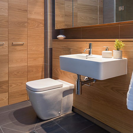 Space-saving floating sink with taps and a convenient towel holder on the side