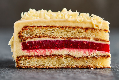 Pre-sliced vanilla sponge and raspberry cake