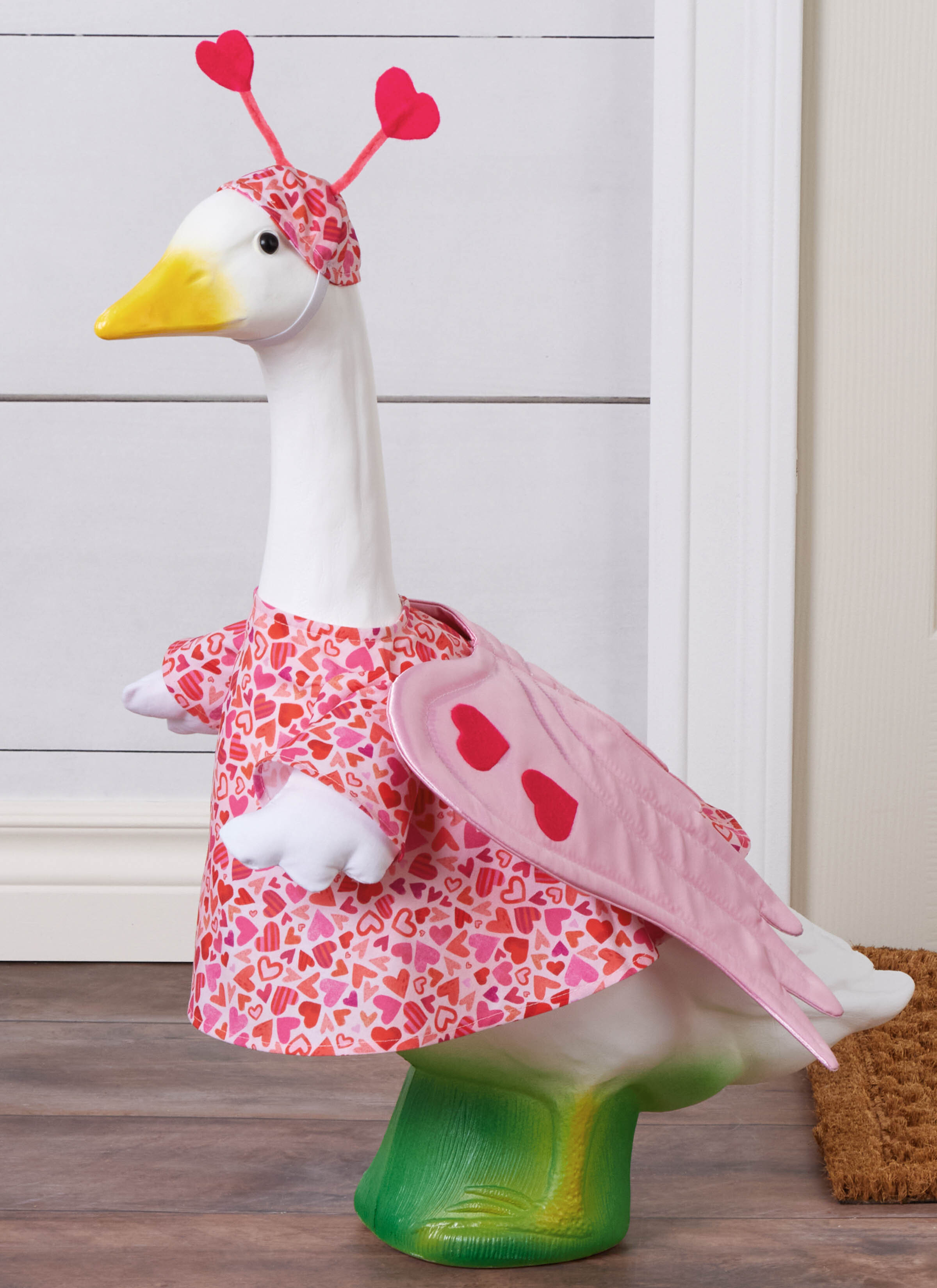 Man wearing brown vest with striped button up shirt